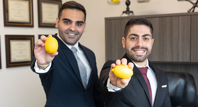 lawyers holding a lemon